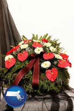 a funeral flower wreath - with Massachusetts icon