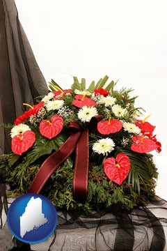 a funeral flower wreath - with Maine icon