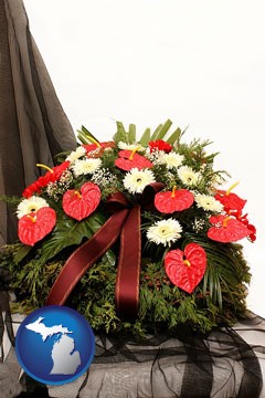a funeral flower wreath - with Michigan icon