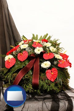 a funeral flower wreath - with North Dakota icon