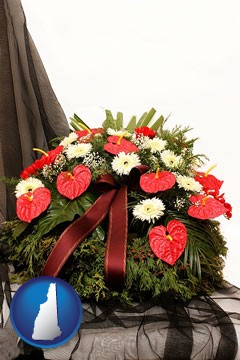 a funeral flower wreath - with New Hampshire icon