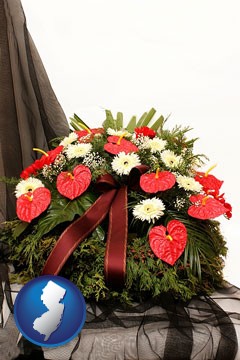 a funeral flower wreath - with New Jersey icon