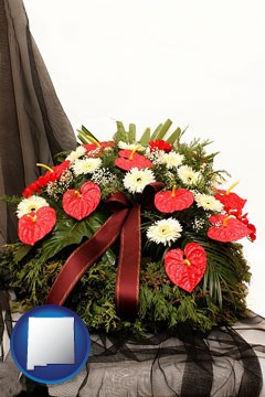 a funeral flower wreath - with New Mexico icon