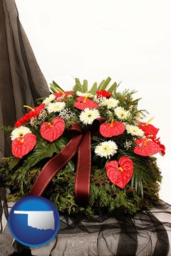 a funeral flower wreath - with Oklahoma icon